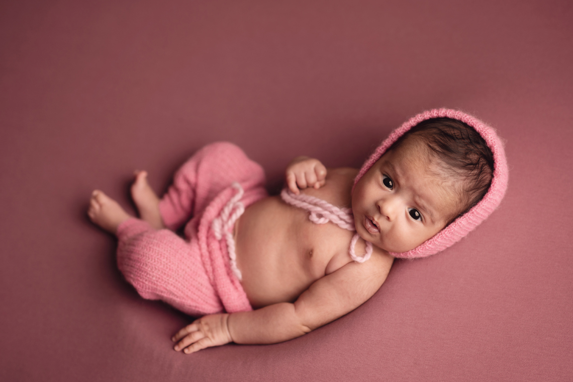 indian seven weeks old baby girl wearing pink outfit