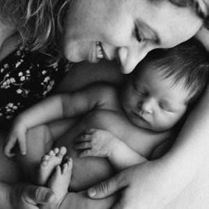 Mom holding newborn baby girl
